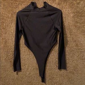 Black high neck, high cut bodysuit